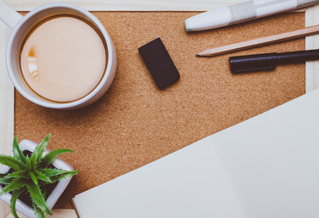 Brownie cheese cake,pen,pencil and coffee on wooden backgroundの写真素材