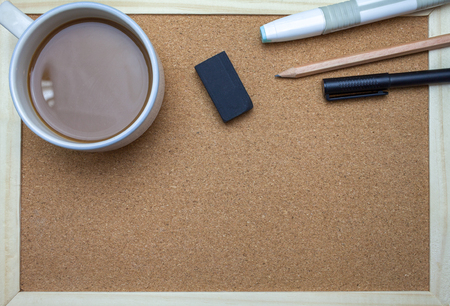 Save Download Preview Pen,book,pencil and coffee on cork board backgroundの写真素材