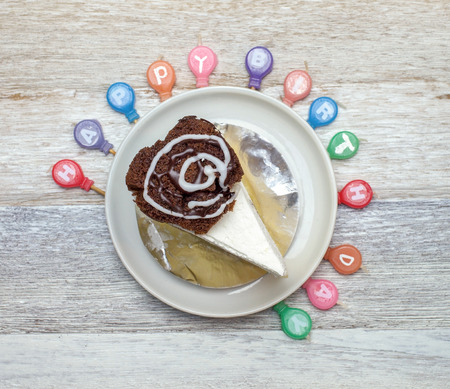 Birthday candles boundary of cake on wooden backgroundの写真素材