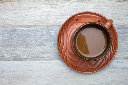 Cup of coffee on wooden backgroundの写真素材