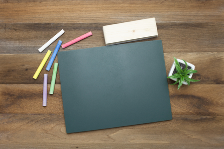 Colorful Chalks,Chalk board and eraser on wooden backgroundの写真素材
