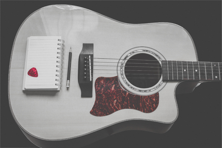 guitar,pencil and scrapbook ,Writing music in vintage toneの写真素材