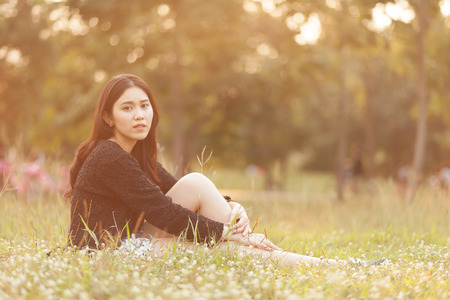 Pretty Thai girl Smiling at the parkの写真素材