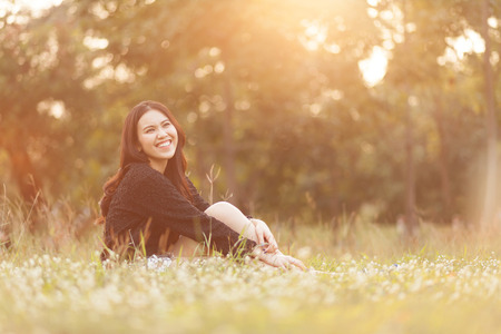 Pretty Thai girl Smiling at the parkの写真素材