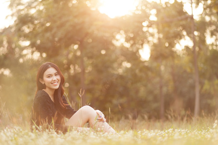 Pretty Thai girl Smiling at the parkの写真素材