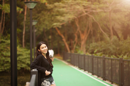 Pretty Thai girl Smiling at the parkの写真素材
