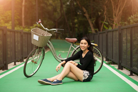 Pretty Thai girl Smiling at the parkの写真素材