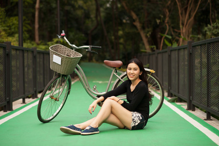 Pretty Thai girl Smiling at the parkの写真素材