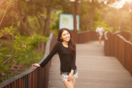Pretty Thai girl Smiling at the parkの写真素材