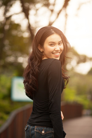 Thai pretty girl jumping and waving hair with a moment happiness.の写真素材