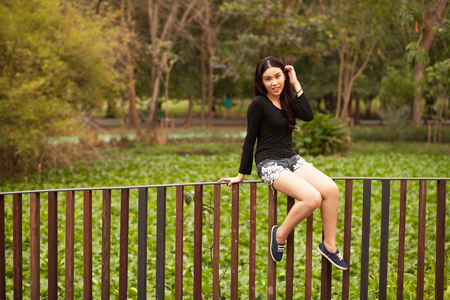 Pretty Thai girl Smiling at the parkの写真素材