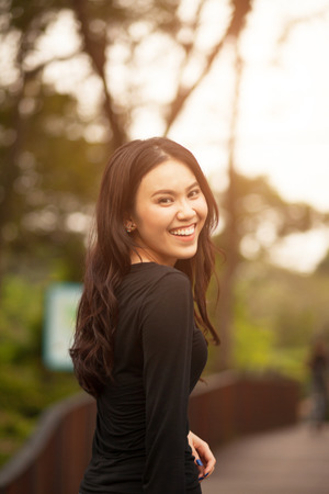 Thai pretty girl jumping and waving hair with a moment happiness.の写真素材