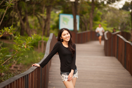 Pretty Thai girl Smiling at the parkの写真素材