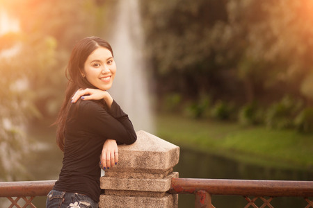 Pretty Thai girl Smiling at the parkの写真素材