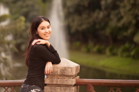 Pretty Thai girl Smiling at the parkの写真素材