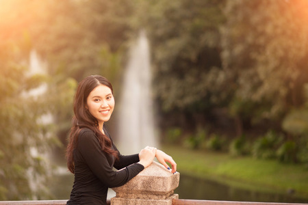 Pretty Thai girl Smiling at the parkの写真素材