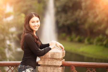 Pretty Thai girl Smiling at the parkの写真素材
