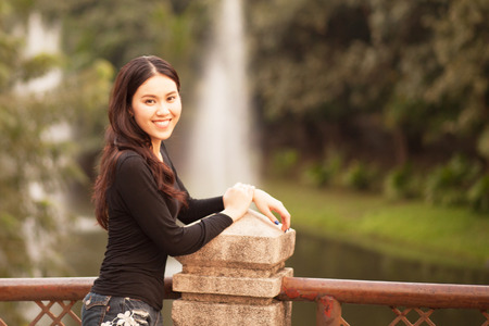 Pretty Thai girl Smiling at the parkの写真素材