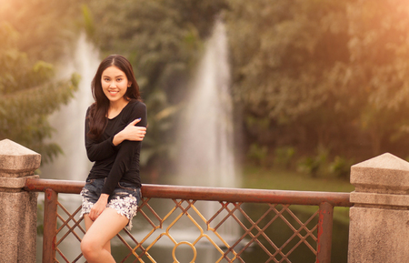 Pretty Thai girl Smiling at the parkの写真素材