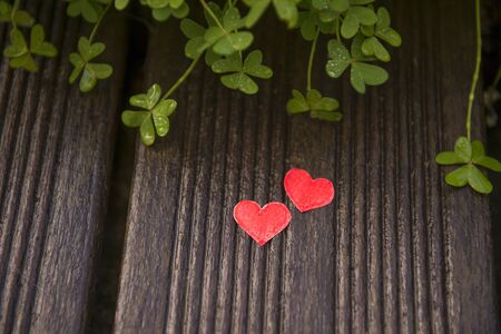 Valentines day card with hearts on a wooden background, love messageの写真素材