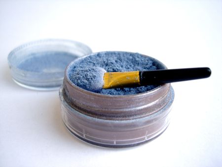 Blue eyeshadow and applicator brush isolatedの写真素材