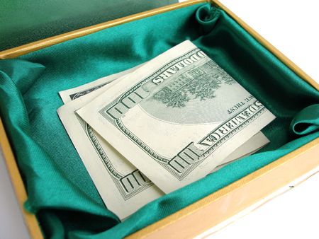 Green small box with one hundred dollar bill stickingの写真素材