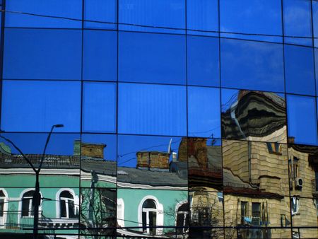 Buildings being reflected in a glass office building in Kiev, Ukraine
