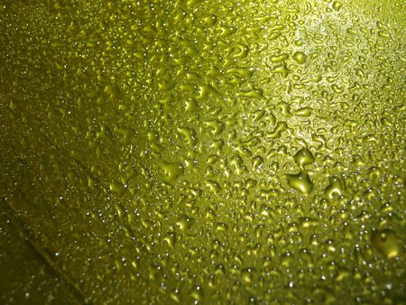 yellow water drop for backgroundの写真素材