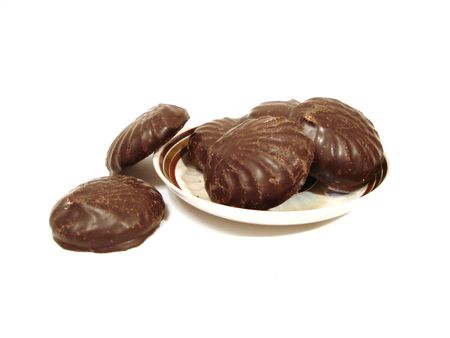 Six chocolate brownies on a plate over white backgroundの写真素材