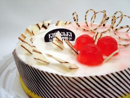 white and pink cake over grey backgroundの写真素材