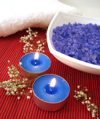 Spa essentials (blue salt, towels, candle and flower) の写真素材