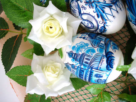 beautiful blue easter eggs with white flowers の写真素材