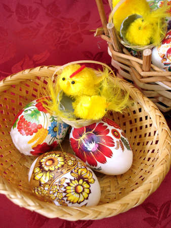 easter eggs and chicken on basket の写真素材