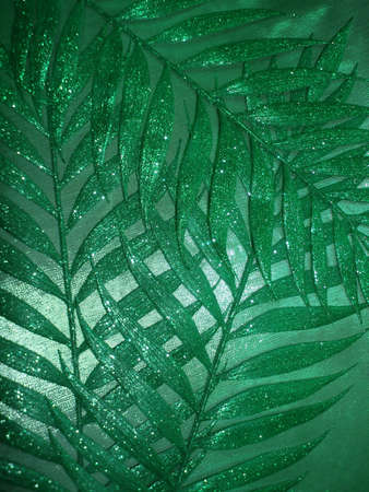green fabric texture and leaves for background の写真素材