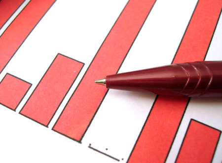 red pen on diagram of financial report の写真素材