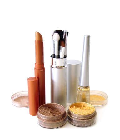 golden set for make-up (brushes, eyeshadows, rouge, nail polish and lipstick) の写真素材