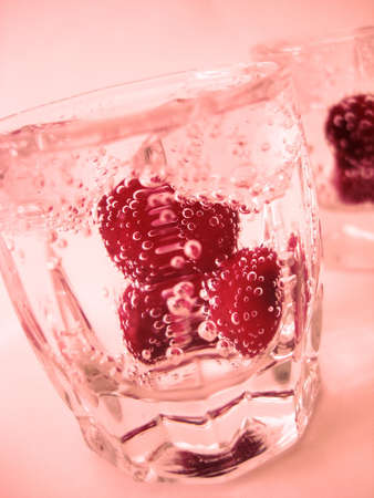 Cherry in glass of mineral water の写真素材