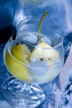 pear in glass with martini and ice の写真素材
