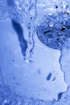 water running down in drain の写真素材