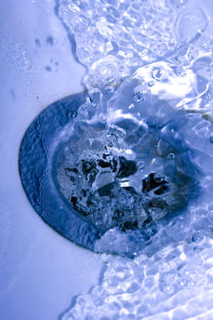 water running down in drain 