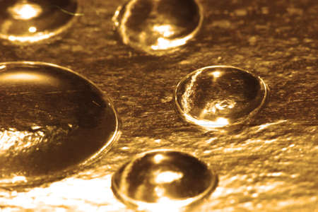 golden water drop for background の写真素材