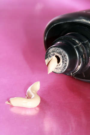 brown cream on pink background 