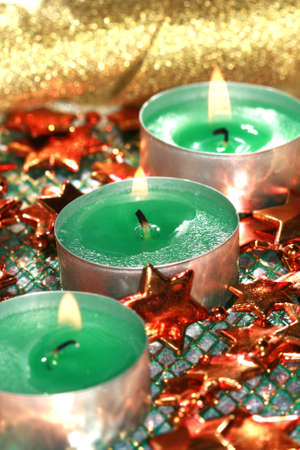green candles with decoration stars の写真素材