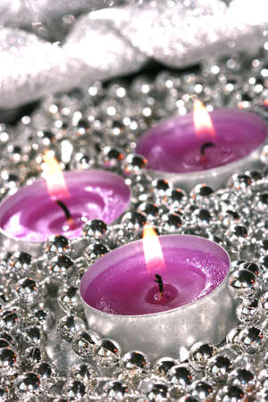 pink candles with silver decoration balls の写真素材