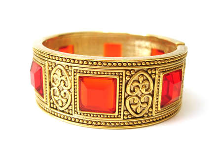 Close-up of golden bracelet isolated on white background の写真素材