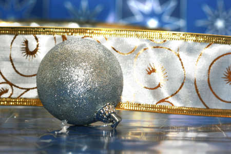 silver Christmas ball on blue background の写真素材