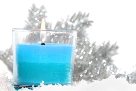 festive new-year candle with snow の写真素材