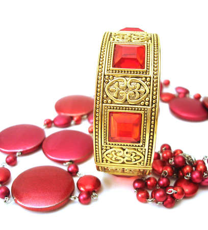 golden bracelet with beads isolated on white background の写真素材