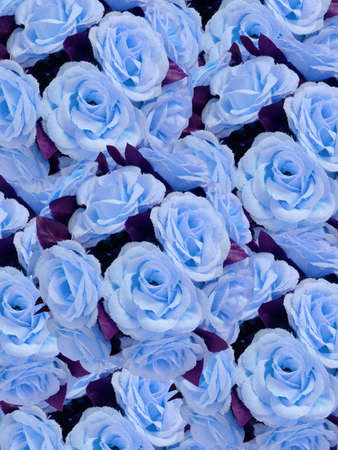 blue artificial flowers for decoration over background の写真素材