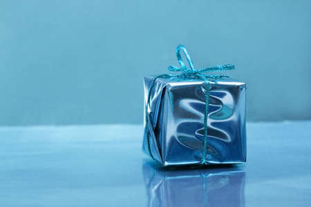 One gift small box on blue background の写真素材